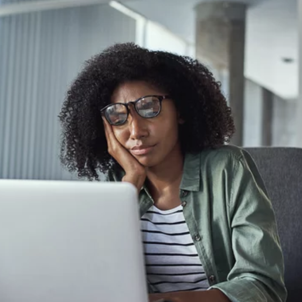 Distressed woman on a computer